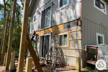 how we resolved an unforeseen change order during a deck project contractor repairing ledger board custom built michigan