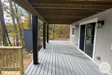 how we resolved an unforeseen change order during a deck project under decking living space with outdoor sconce light fixtures custom built michigan