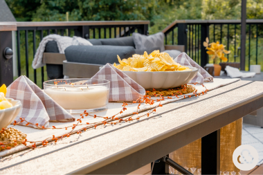 landscaping renovations to plan now for summer enjoyment outdoor dining table on composite deck custom built michigan