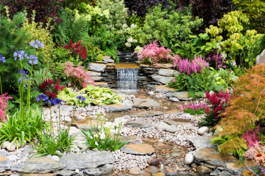landscaping renovations to plan now for summer enjoyment backyard mini water and stream custom built michigan