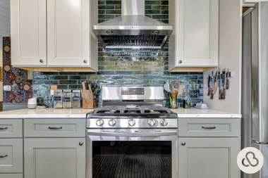 what are the benefits of kitchen remodeling culinary space with luxury cabinets and dark subway tile backsplash custom built michigan