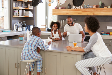 what are the benefits of kitchen remodeling family enjoying breakfast together at island custom built michigan