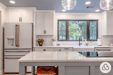 what are the benefits of kitchen remodeling luxury culinary space with white cabinets and large island custom built michigan