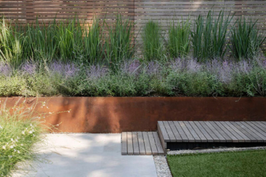 top pathway and walkway ideas for your michigan outdoor living space wood plank bridge path next to retaining wall custom built okemos