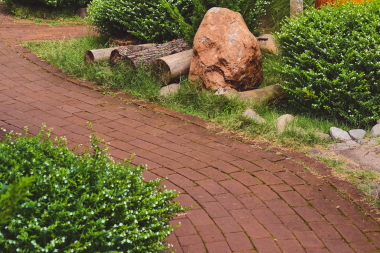 top pathway and walkway ideas for your michigan outdoor living space brick pattern path with bushes custom built okemos