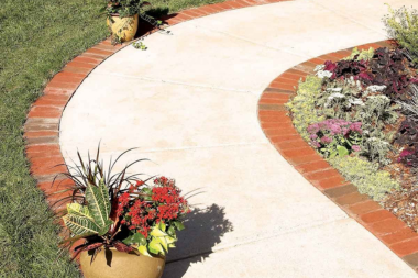 top pathway and walkway ideas for your michigan outdoor living space concrete path with brick borders custom built okemos