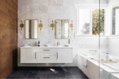 top fall bathroom remodel ideas for comfort and style double sink vanity with layered gold mirror sconces custom built michigan