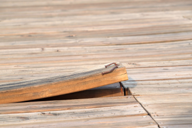 deck replacement in northern michigan what vacation homeowners should know warping wood decking board custom built boyne city