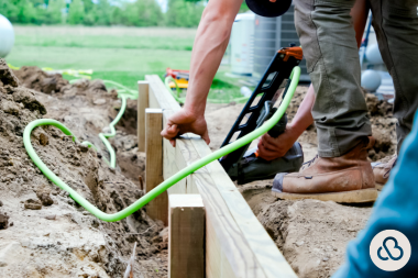 deck replacement in northern michigan what vacation homeowners should know decking contractors laying down framing boards custom built boyne city