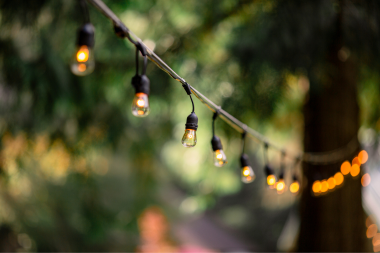 home lighting design tips to brighten shorter fall days string lights in outdoor living space custom built michigan