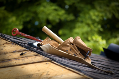 misconceptions about roof replacement projects in michigan roofing contractor tool bag on shingles custom built okemos