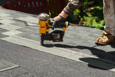misconceptions about roof replacement projects in michigan contractor installing asphalt shingles custom built okemos