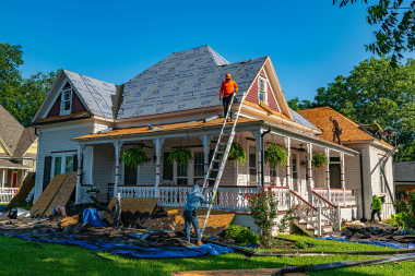 misconceptions about roof replacement projects in michigan roofing contractors using ladder to replace materials custom built okemos