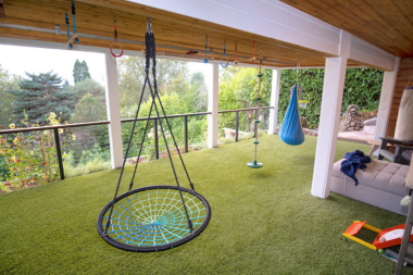 michigan under deck outdoor living space ideas kids play zone with hammock and sofas custom built okemos