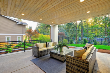 michigan under deck outdoor living space ideas covered lounge area with sectional sofas and ottoman coffee table custom built okemos