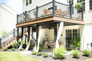 michigan under deck outdoor living space ideas walk out patio with composite stairs and railing custom built okemos