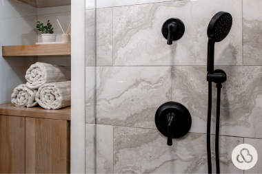 bathroom remodel cost myths every homeowner should know matte black shower fixtures with gray tiles custom built michigan