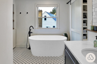bathroom remodel cost myths every homeowner should know freestanding bathtub with patterned tile floor custom built michigan