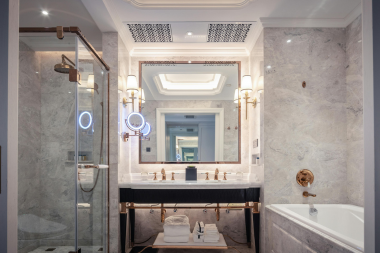bathroom remodel cost myths every homeowner should know framed mirror and sink vanity with integrated bathtub custom built michigan