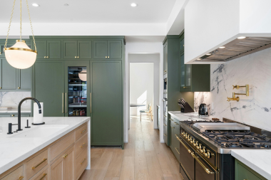 how to prioritize home remodeling projects when you cant do them all large kitchen remodel with detailed cabinetry and island countertop custom built michigan