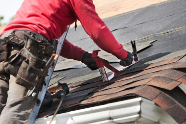 how to prioritize home remodeling projects when you cant do them all remodeler replacing roofing shingles custom built michigan