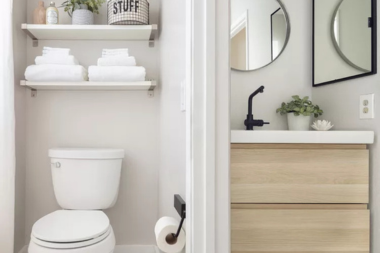 tips for designing a functional guest bathroom separate toilet and sink areas with open shelving custom built michigan