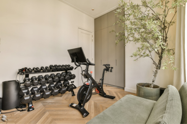 home gym ideas for your remodel multipurpose fitness room with dumbbells and workout bike custom built michigan