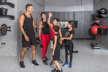 home gym ideas for your remodel family working out in garage with exercise balls and bands custom built michigan
