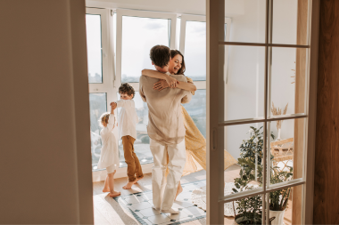 signs its time to build a home addition family dancing together in sunroom custom built michigan