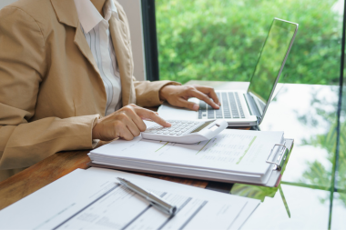 mistakes to avoid while financing your home remodel homeowner building remodeling budget at desk custom built michigan