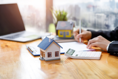 mistakes to avoid while financing your home remodel lender signing loan document custom built michigan