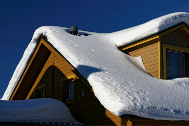 common mistakes to avoid while choosing your roof replacement material snow on top of cabin custom built michigan