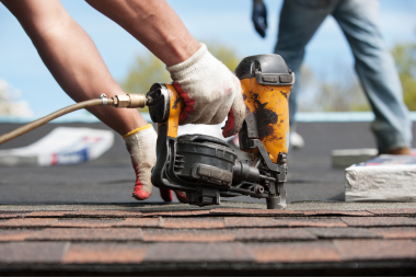 common mistakes to avoid while choosing your roof replacement material roofing contractor installing shingles custom built michigan