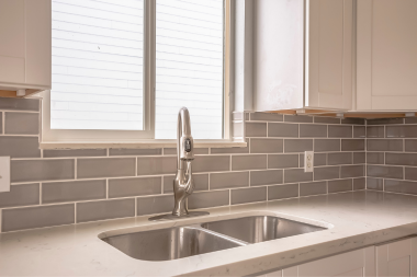 comparing kitchen sink styles for your home remodel double basin stainless steel design with tile backsplash custom built michigan