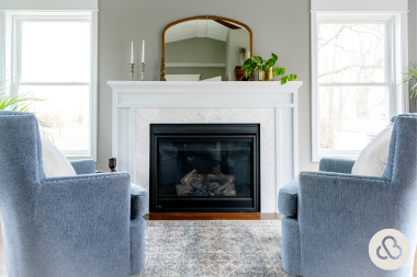 ways to heat your home addition in michigan sunroom sitting area with armchairs and fireplace custom built okemos