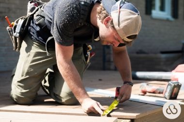 Greater Lansing deck contractor with Custom Built Design and Remodeling measuring composite decking joist