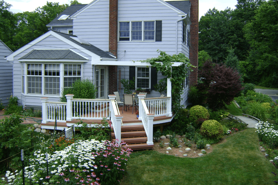 whens the best time of year to remodel your michigan home backyard deck with landscaping custom built okemos