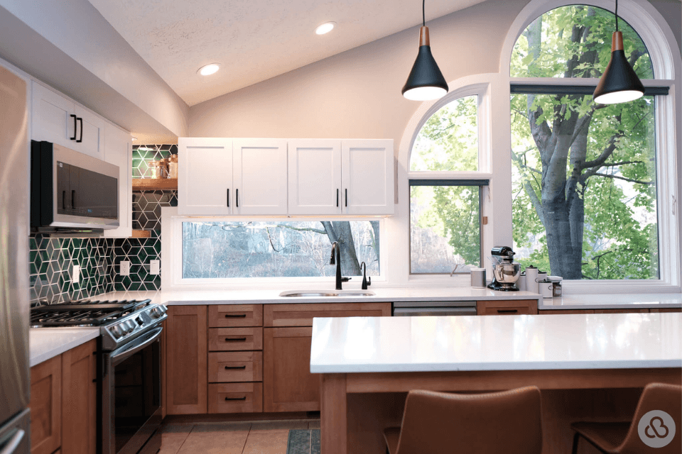 luxury kitchen remodel features island range windows cabinets custom built