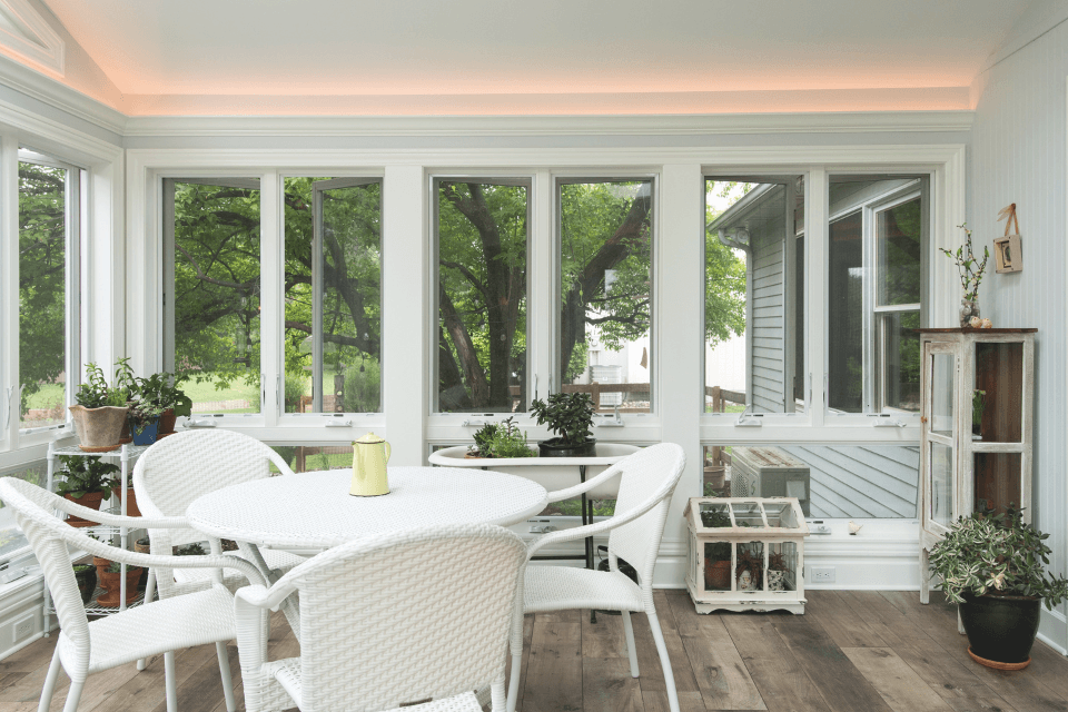 pros and cons of home addition contractors sunroom with tables and chairs custom built michigan