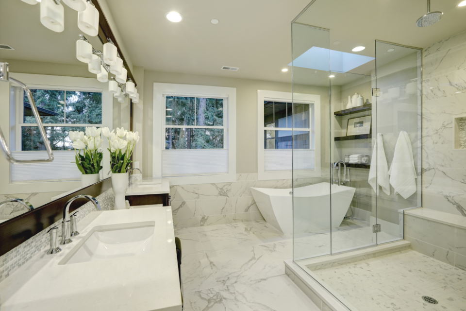 comparing bathroom countertop options for your home remodel bathtub and glass shower custom built michigan
