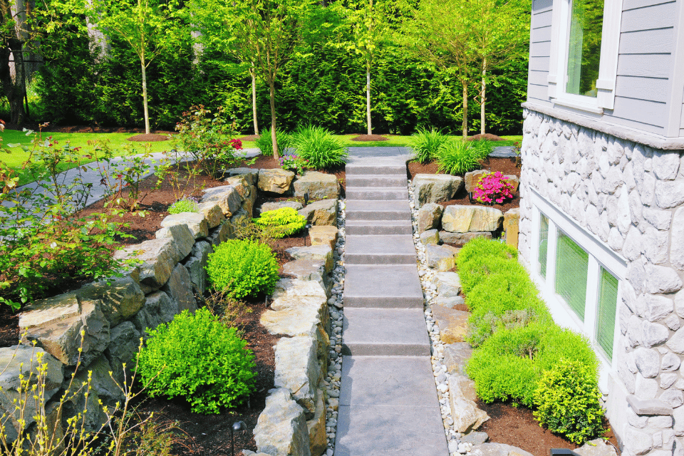 landscaping mistakes to avoid while remodeling your outdoor living space pavers and rock wall custom built michigan