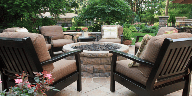 fire pit area designs for your northern michigan backyard circular fireplace with outdoor chairs custom built boyne city