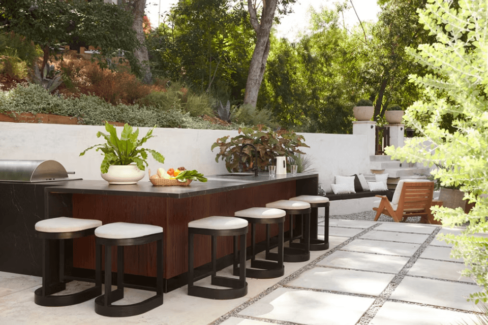 ways to create your dream outdoor kitchen long bar with barstools custom built michigan