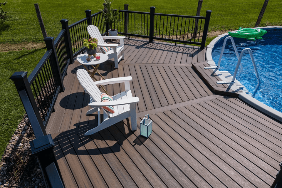 making a decking splash comparing composite pool deck designs above ground swimming area with adirondack chairs custom built michigan