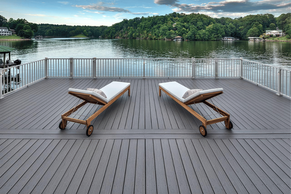 best trex decking accessories to complete your outdoor living space lounge chairs on composite deck overlooking lake custom built michigan